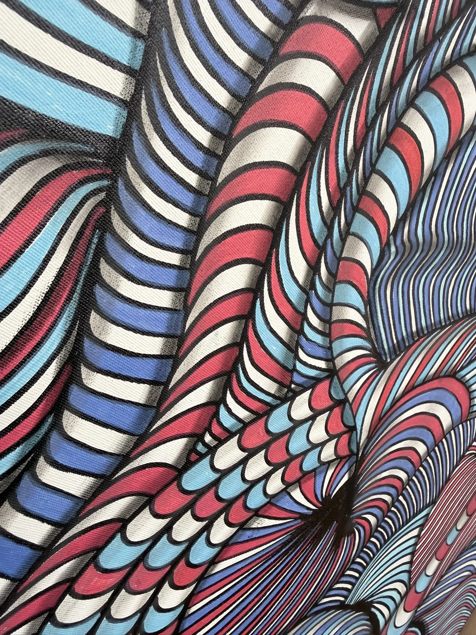 Chromatic Currents is an original one-of-a-kind painting on canvas created with marker, ink and pastel. A dense network of red, blue, black and white lines moves across the surface in continuous waves, folds and interlocking forms. Each hand-drawn band follows its own trajectory, yet together they construct a highly controlled visual system in which the canvas appears to expand, contract and shift in depth. The composition combines the graphic intensity of optical abstraction with a distinctly organic rhythm. Lines curve around one another, compress into narrow passages and open into larger volumes, transforming a flat surface into an almost sculptural field of movement. From a distance, the strong red and blue palette creates immediate impact. Viewed more closely, the individual marks reveal the complexity and physical process behind the work. The result is an artwork that changes with proximity and rewards sustained viewing. Chromatic Currents is conceived as more than decoration. Its scale of movement, chromatic contrast and dense visual structure give it the power to define an environment. In a contemporary residence, private collection, executive interior or architectural setting, the painting becomes a central visual presence rather than a secondary accent. For collectors seeking original contemporary abstract painting, optical art and distinctive mixed-media work, Chromatic Currents offers both immediate graphic strength and the unmistakable individuality of a hand-created canvas. Medium: Painting, Marker / Ink / Pastel on Canvas Original: One-of-a-kind artwork Signature: Hand-signed by the artist Shipping: Free Shipping SEO Keywords abstract painting, optical art, op art, contemporary art, mixed media, canvas painting, marker art, ink art, pastel art, statement art, collectible art, luxury art, interior art, original painting